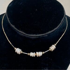 Liquid silver and puka shell necklace